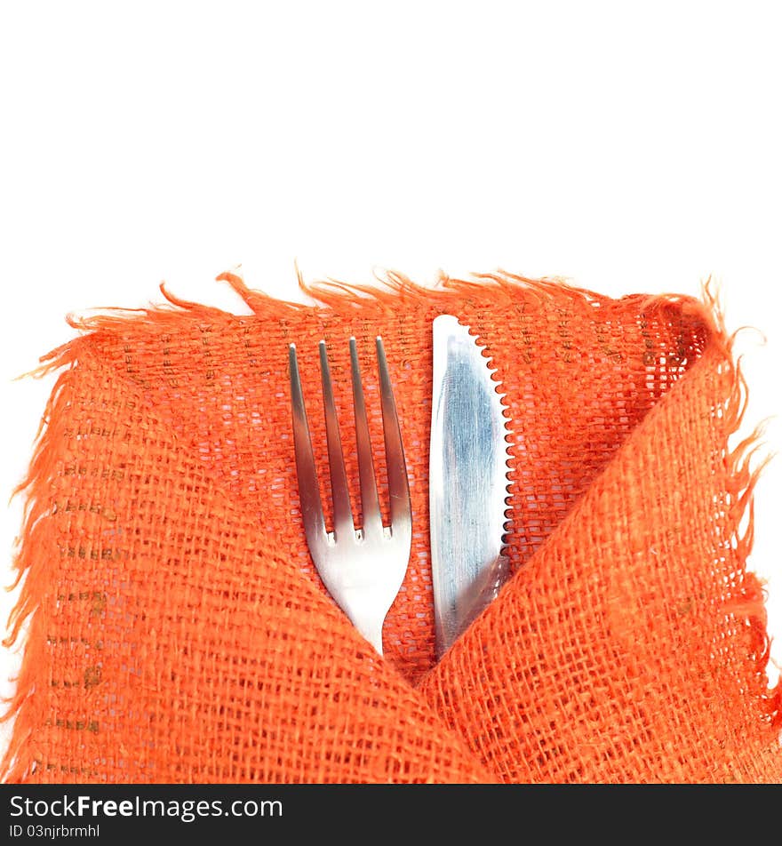 Knife, Fork And A Napkin On White