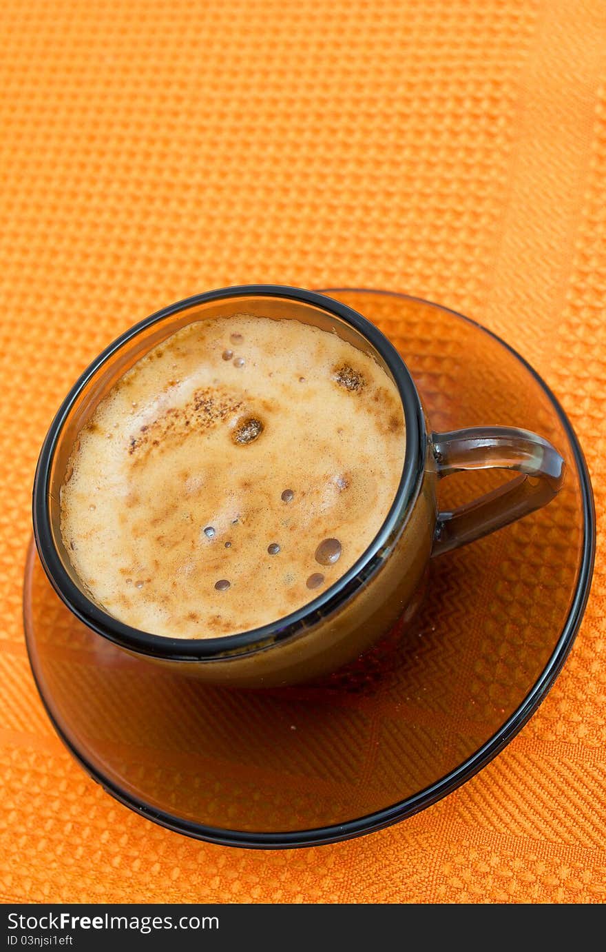 Cappuccino on napkin on white background