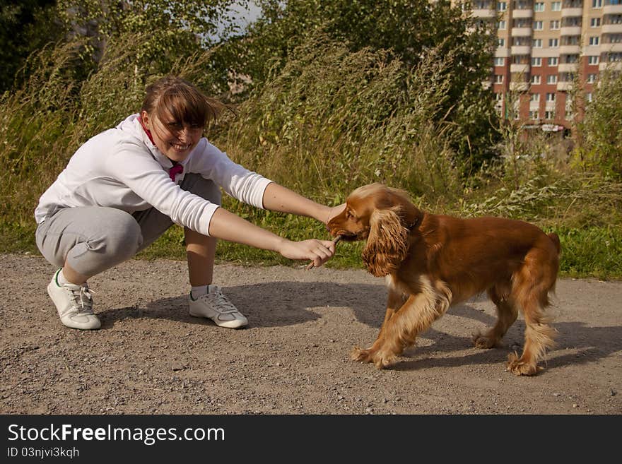 Young girl plays with her dog. Young girl plays with her dog