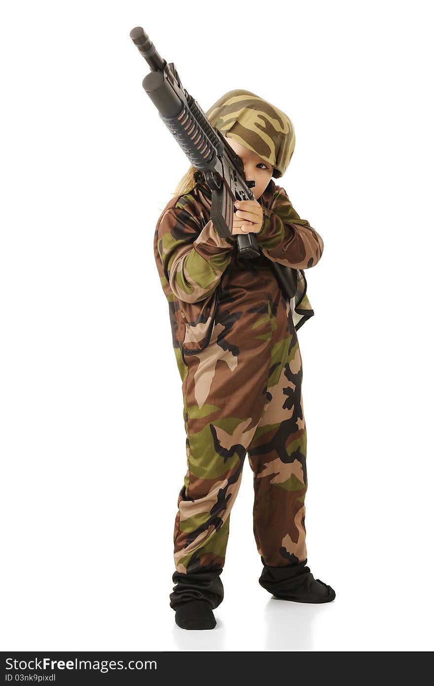 A cute little girl taking aim with a toy machine gun while playing soldier.  Isolated.