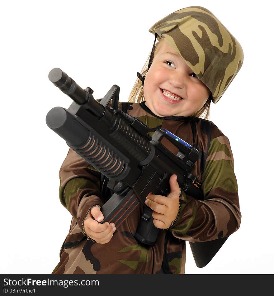 Closeup image of a tiny girl soldier delightedly firing a toy machine gun. Isolated. Closeup image of a tiny girl soldier delightedly firing a toy machine gun. Isolated.