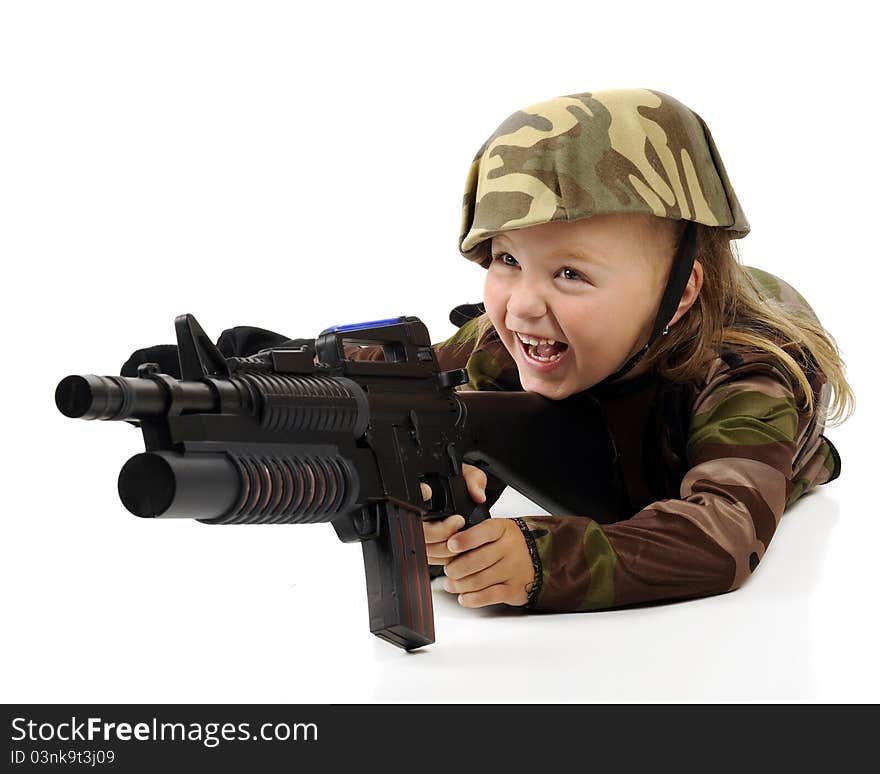 A pretty little girl having fun in a camouflage soldier's outfit while shooting a toy machine gun. Isolated. A pretty little girl having fun in a camouflage soldier's outfit while shooting a toy machine gun. Isolated.