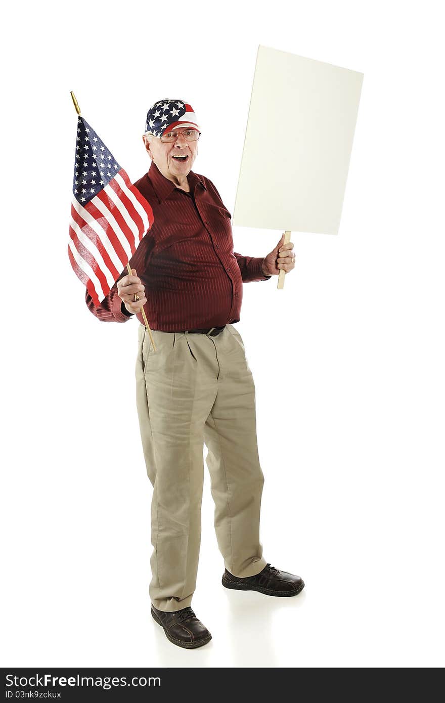 A happy senior man wearing his stars and stripes while carrying an American flag and blank sign. Isolated on white. A happy senior man wearing his stars and stripes while carrying an American flag and blank sign. Isolated on white.