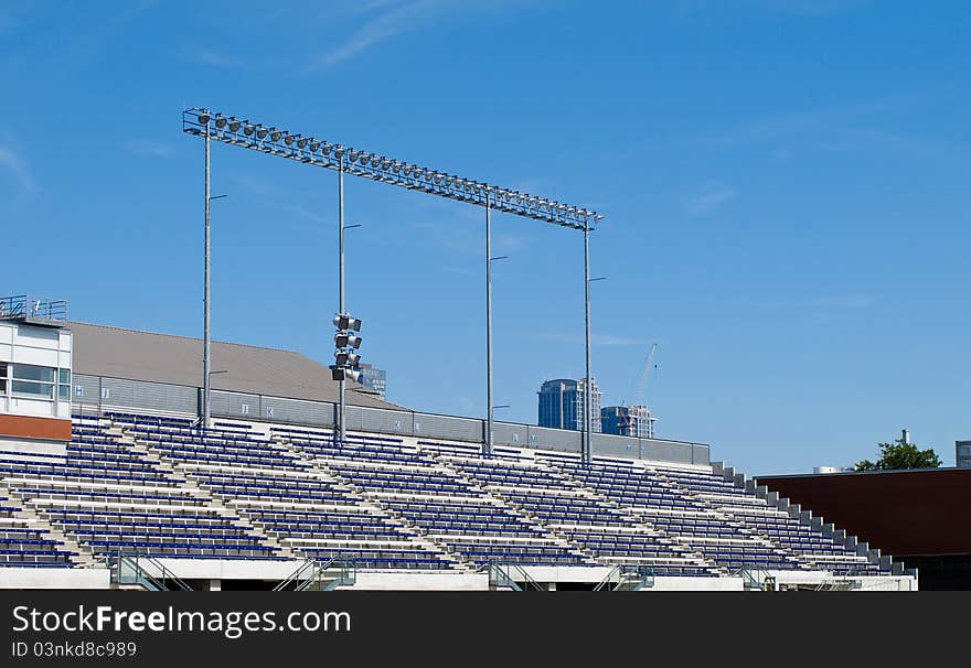 Stadium seating in daytime under blue sky. Stadium seating in daytime under blue sky