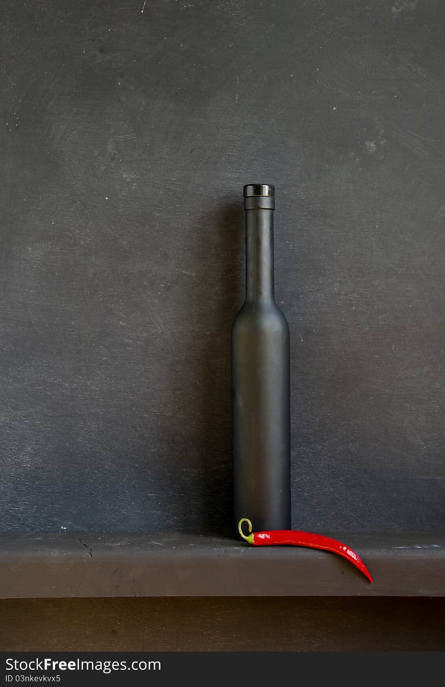 Black Still-life With Red Pepper