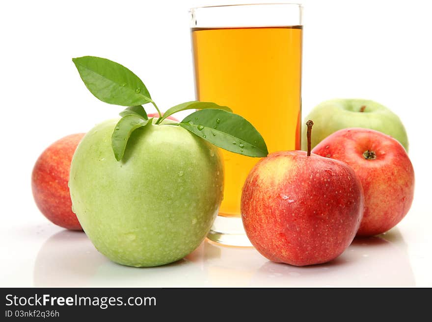 Ripe fruit and juice on a white background