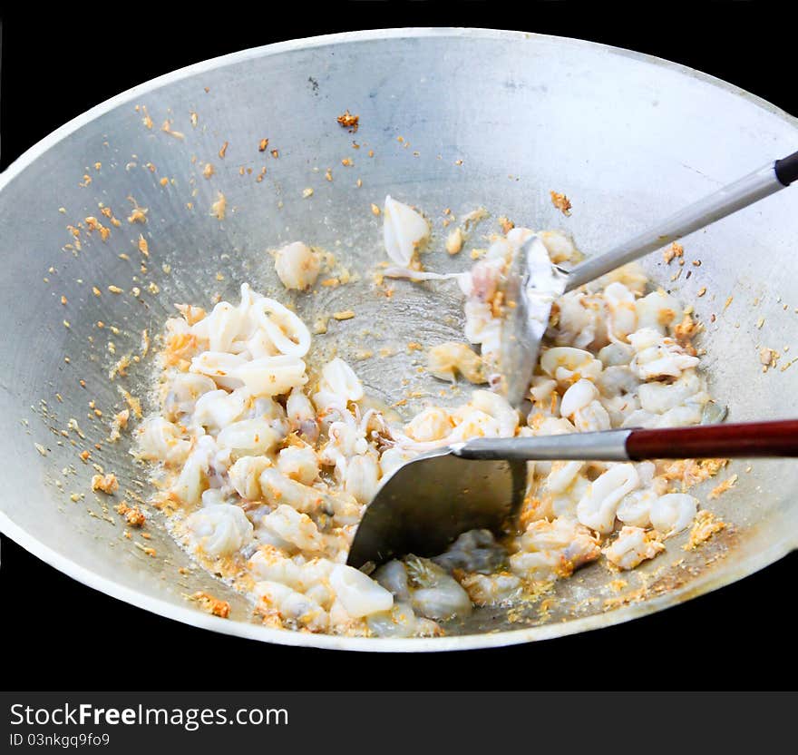 Cooking seafood in a big pan