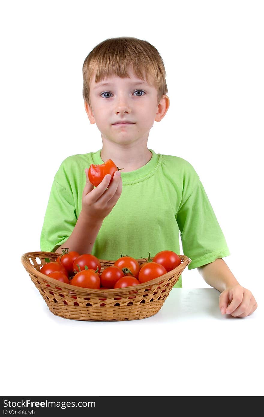 Boy with tomatoes isolated on a white background