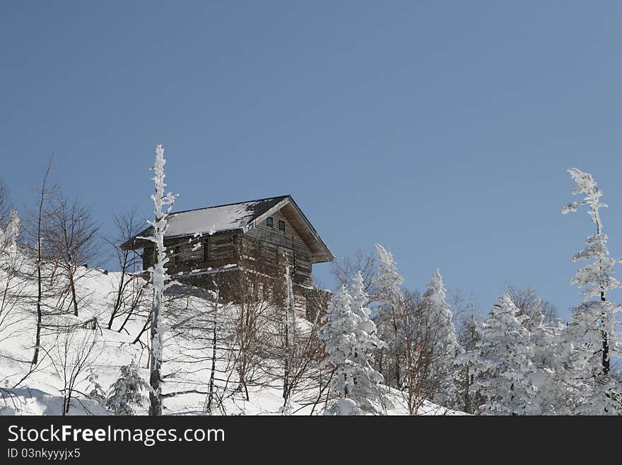 Wooden snow hut in snow mountain