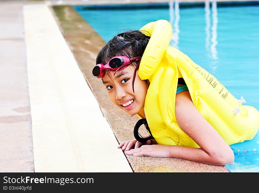 Girls are trained to swim. With the yellow life jacket. Girls are trained to swim. With the yellow life jacket.