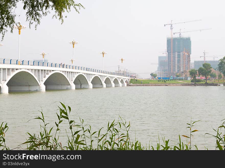 A bridge across the river in a park