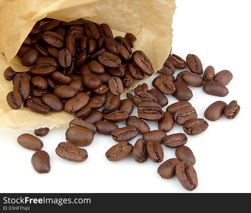 Paper paper bag with coffee grains on a white background