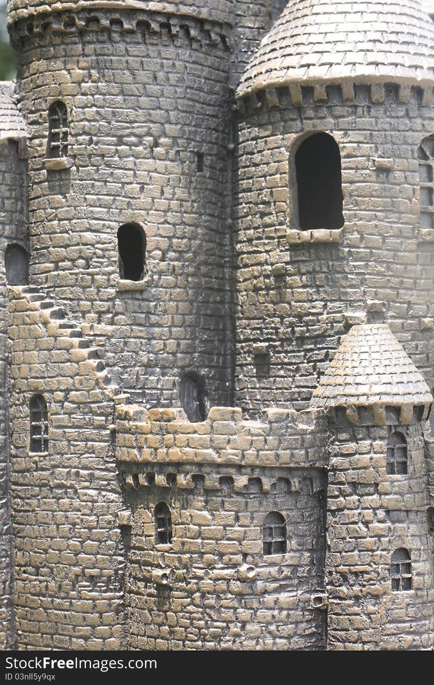 Photo of a plastic castle showing windows and stairs.