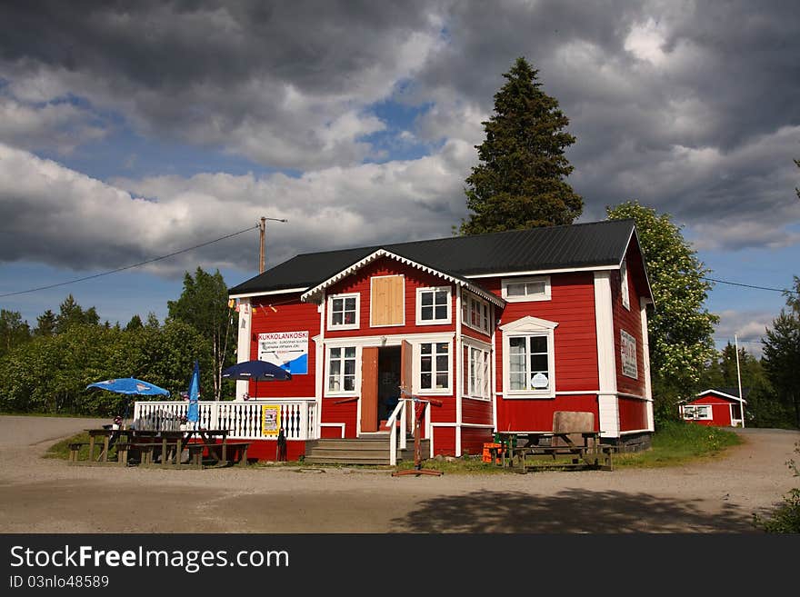 Traditional looking scandinavian wooden house on a sunny day