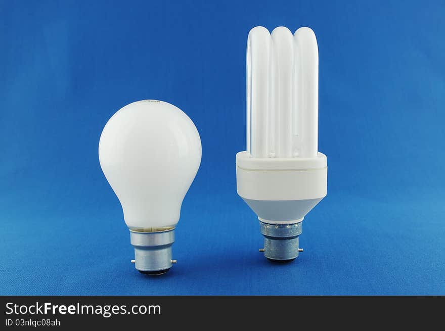 Showing the difference between traditional and energy saving bulbs. Showing the difference between traditional and energy saving bulbs