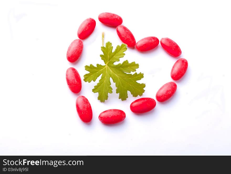 Red drugs form hearth, the green leave is of Geranium. Red drugs form hearth, the green leave is of Geranium