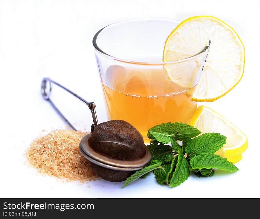 Tea with fresh mint leaves and old tea strainer. Tea with fresh mint leaves and old tea strainer