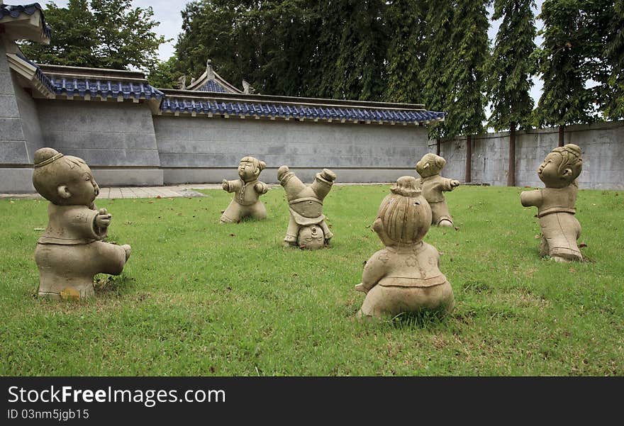 The Statue Of Kids In Kung Fu Action