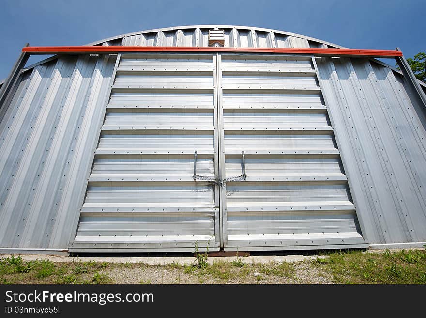 Wide angle abstract closeup image of a huge steel warehouse. Wide angle abstract closeup image of a huge steel warehouse.