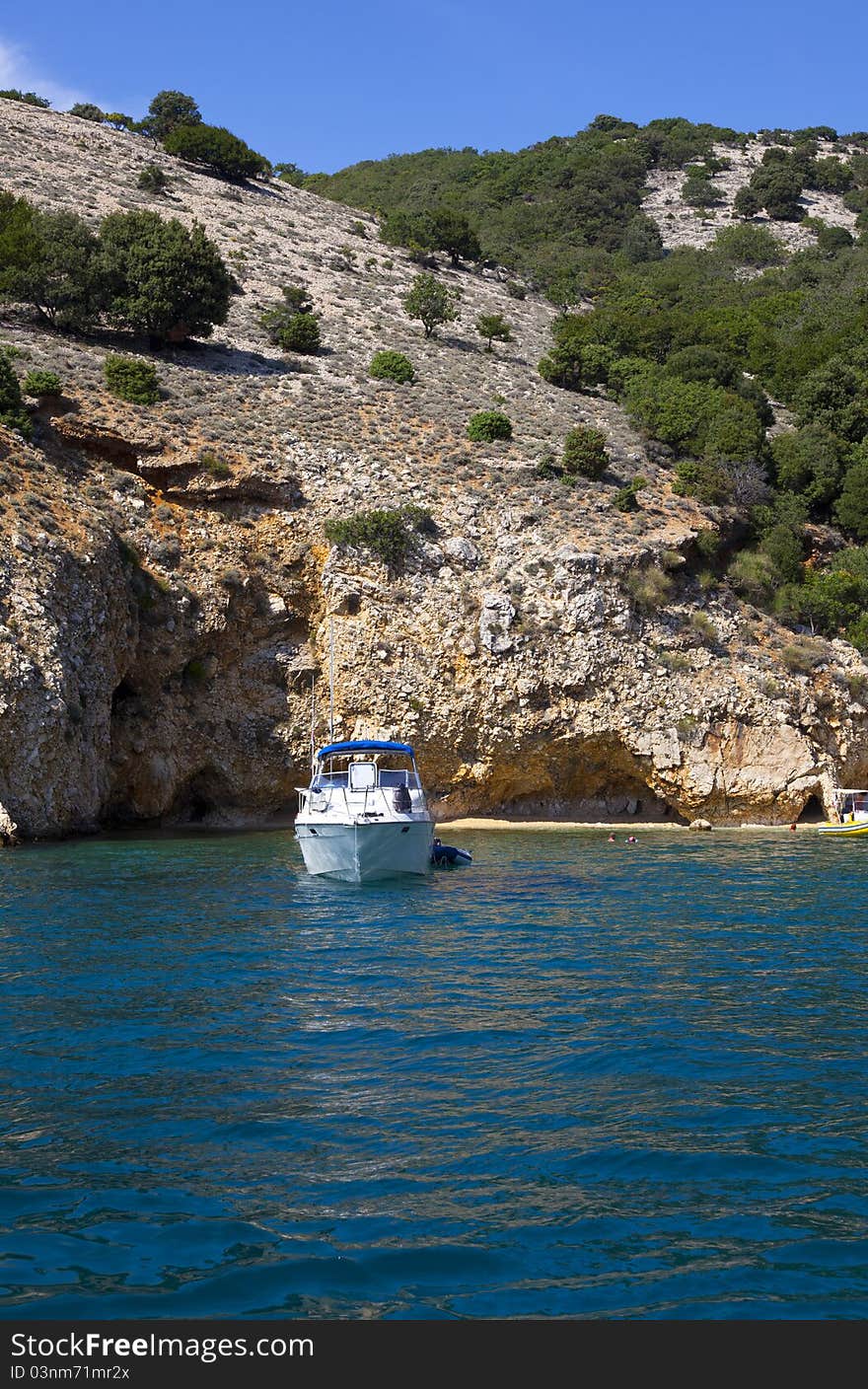 A boat anchored on a private beach