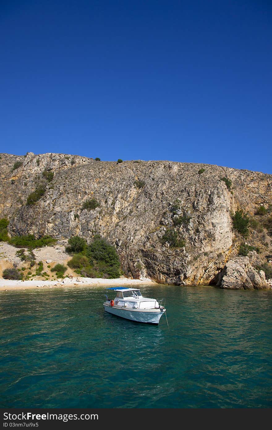 A boat anchored on a private beach