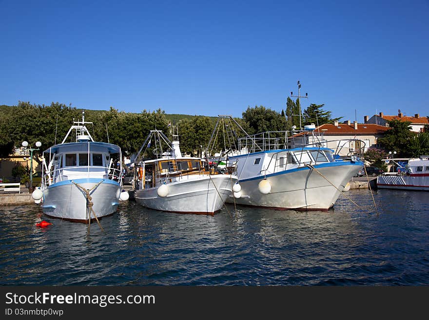 Three fishing boats in a croatian harbour