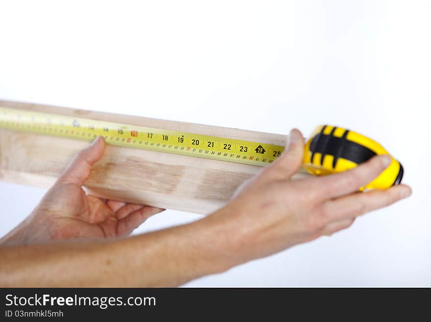 Closeup of measuring tape and wood