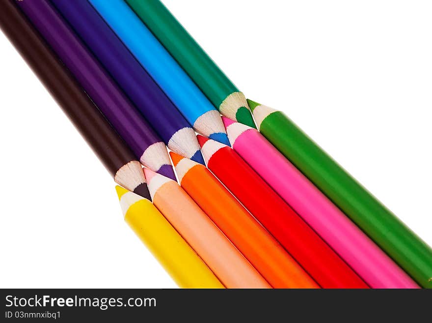 Colorful wooden crayons isolated over white background. Colorful wooden crayons isolated over white background.