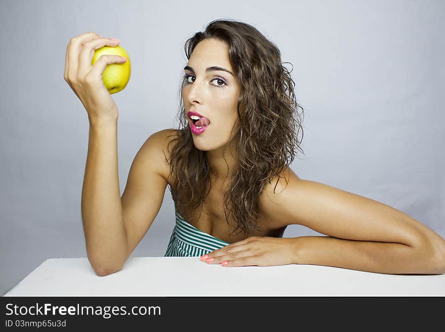 Girl eating a green apple. Girl eating a green apple