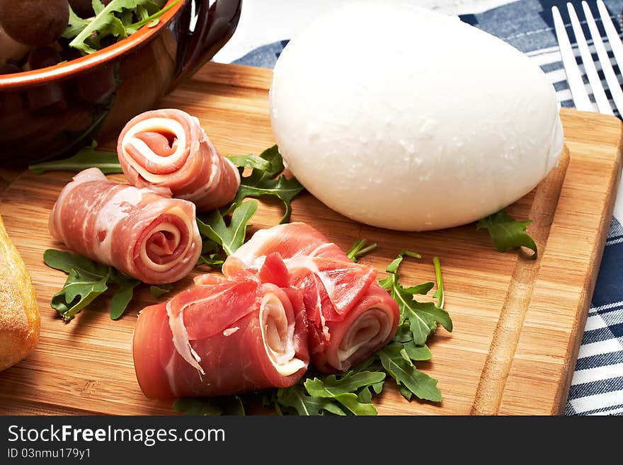 Italian raw ham rolled with cheese and mozzarella.