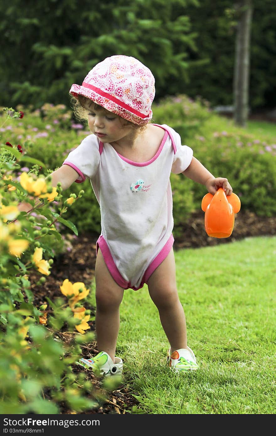 Little cute girl is playing and gardening. Little cute girl is playing and gardening