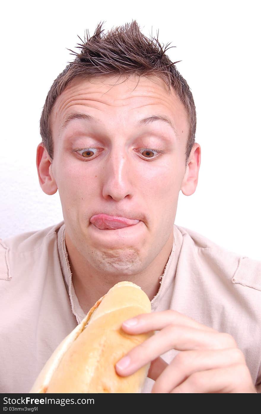 Portrait of a young man preparing to eat his sandwich