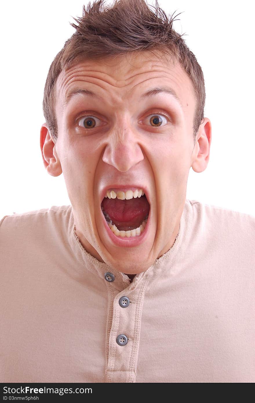 Portrait of a young manscreaming into the camera, isolated on white. Portrait of a young manscreaming into the camera, isolated on white