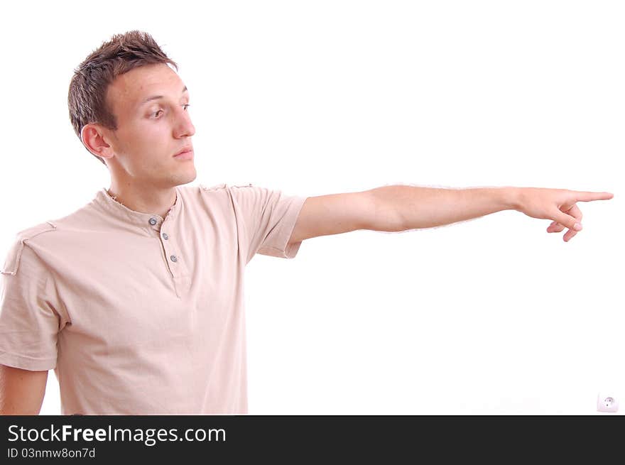 Portrait of a casual young man pointing his finger at something, isolated on white. Portrait of a casual young man pointing his finger at something, isolated on white