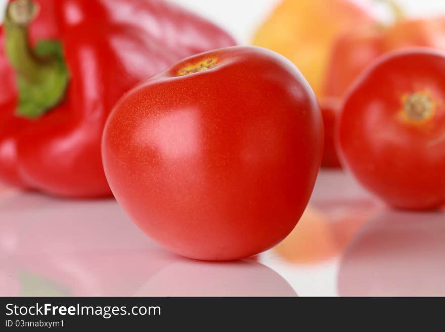 Tomatoes, vegetables on the background. Tomatoes, vegetables on the background.