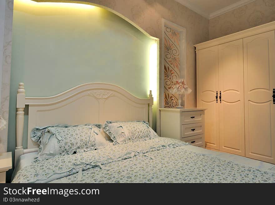 Lighting color bedding room interior, in light pink, blue and cream color, shown as elegance style and comfortable life.