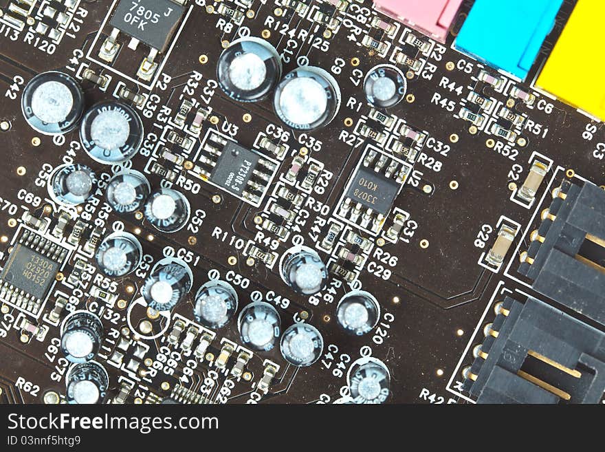 The printed-circuit board with electronic components macro background