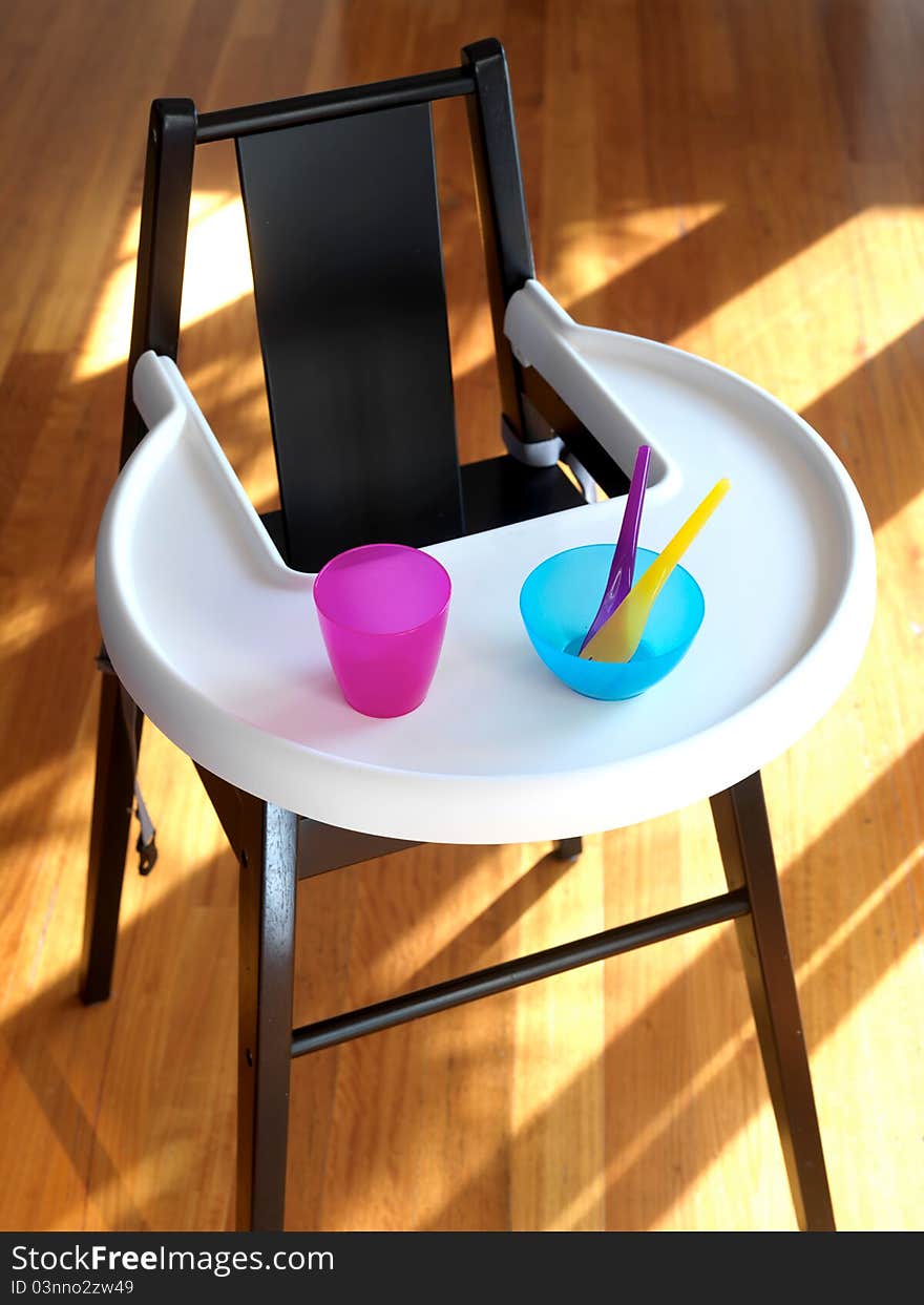 An infants highchair in a modern kitchen