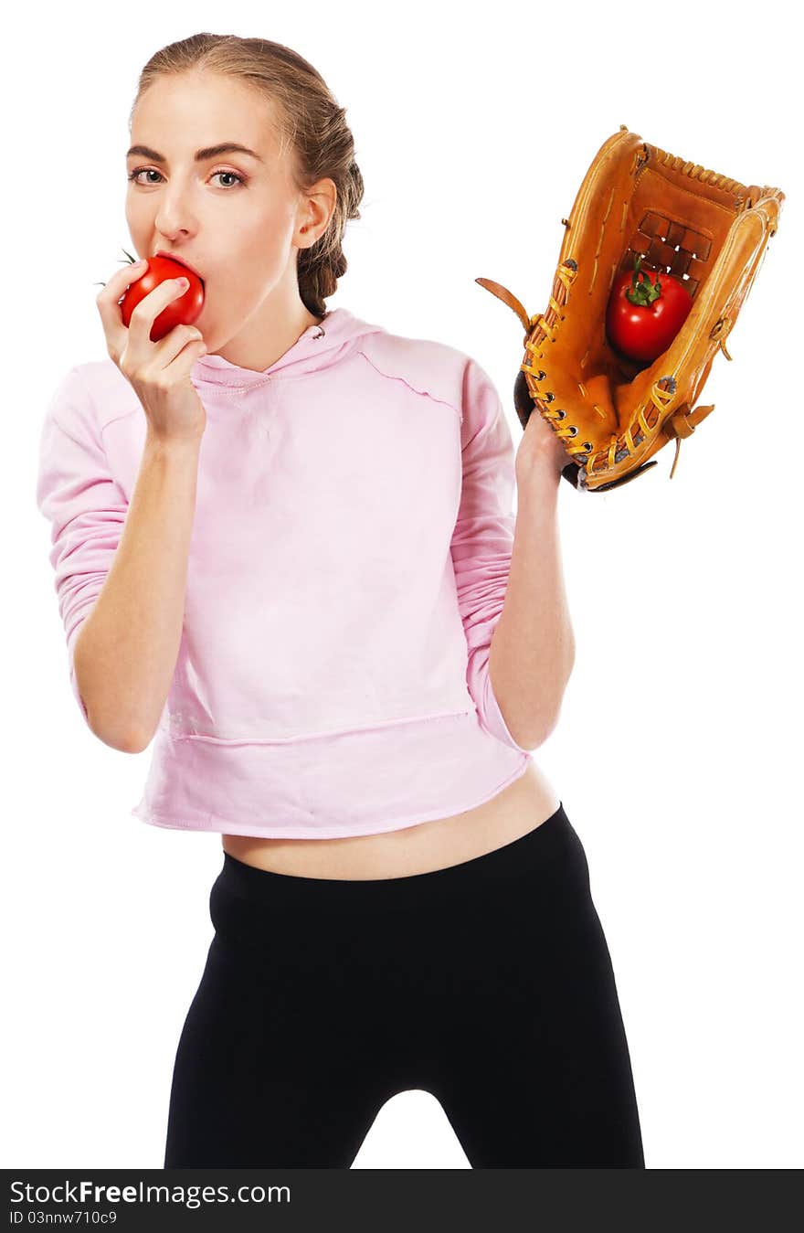 Young woman holding a tomato in baseball glove