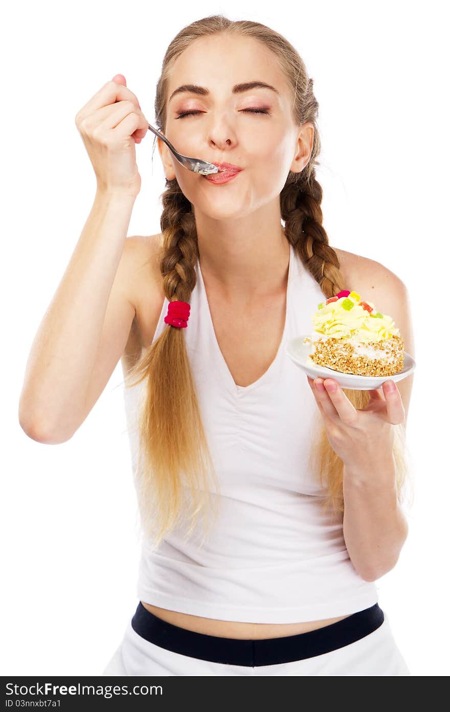 Young lady tasting a cake, studio portrait. Young lady tasting a cake, studio portrait