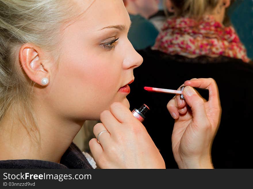 Young woman getting a make-up. Young woman getting a make-up