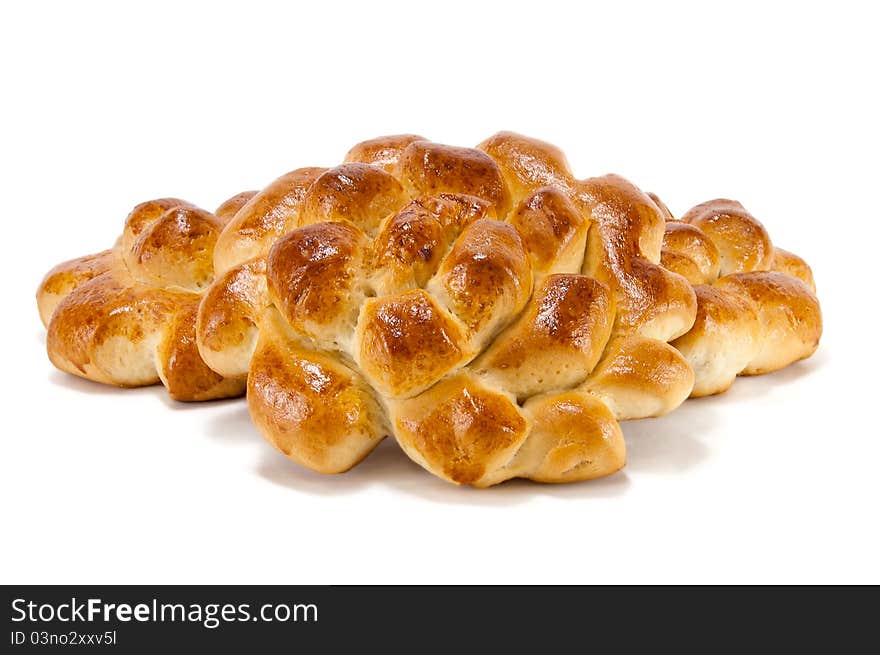 Delicious baked bun on a white background. Delicious baked bun on a white background