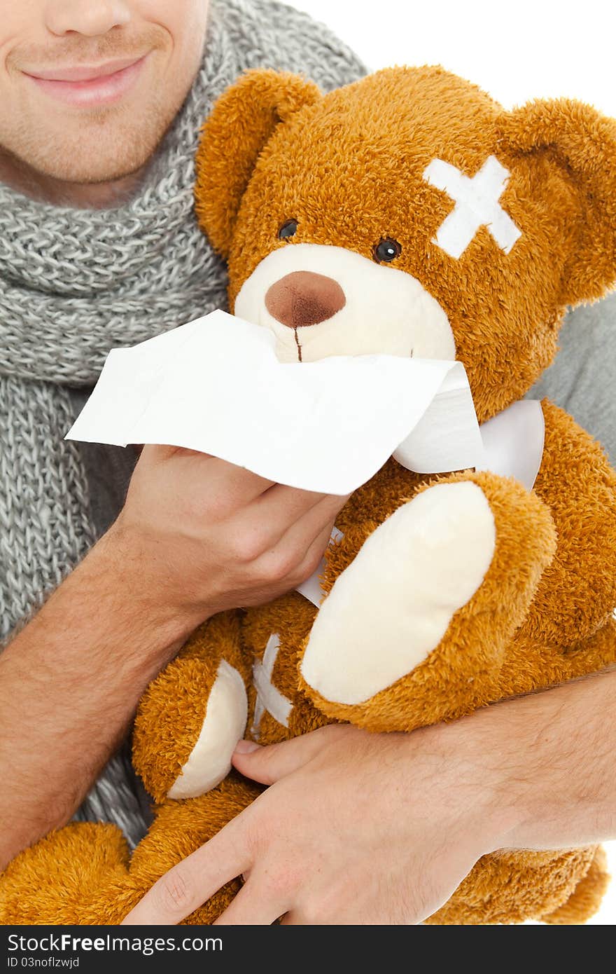 Man holding a bear and tissue. Man holding a bear and tissue