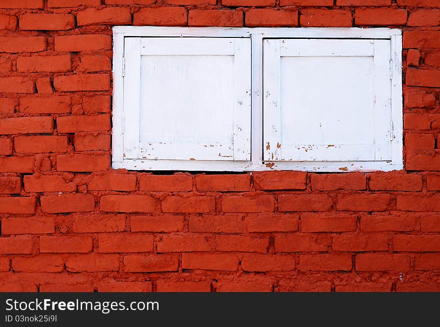 The white windows and brick walls. The white windows and brick walls