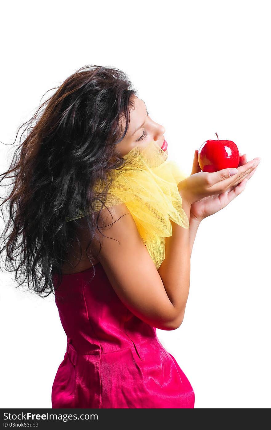 Beautiful brunette woman with red apple in hands isolated on white background