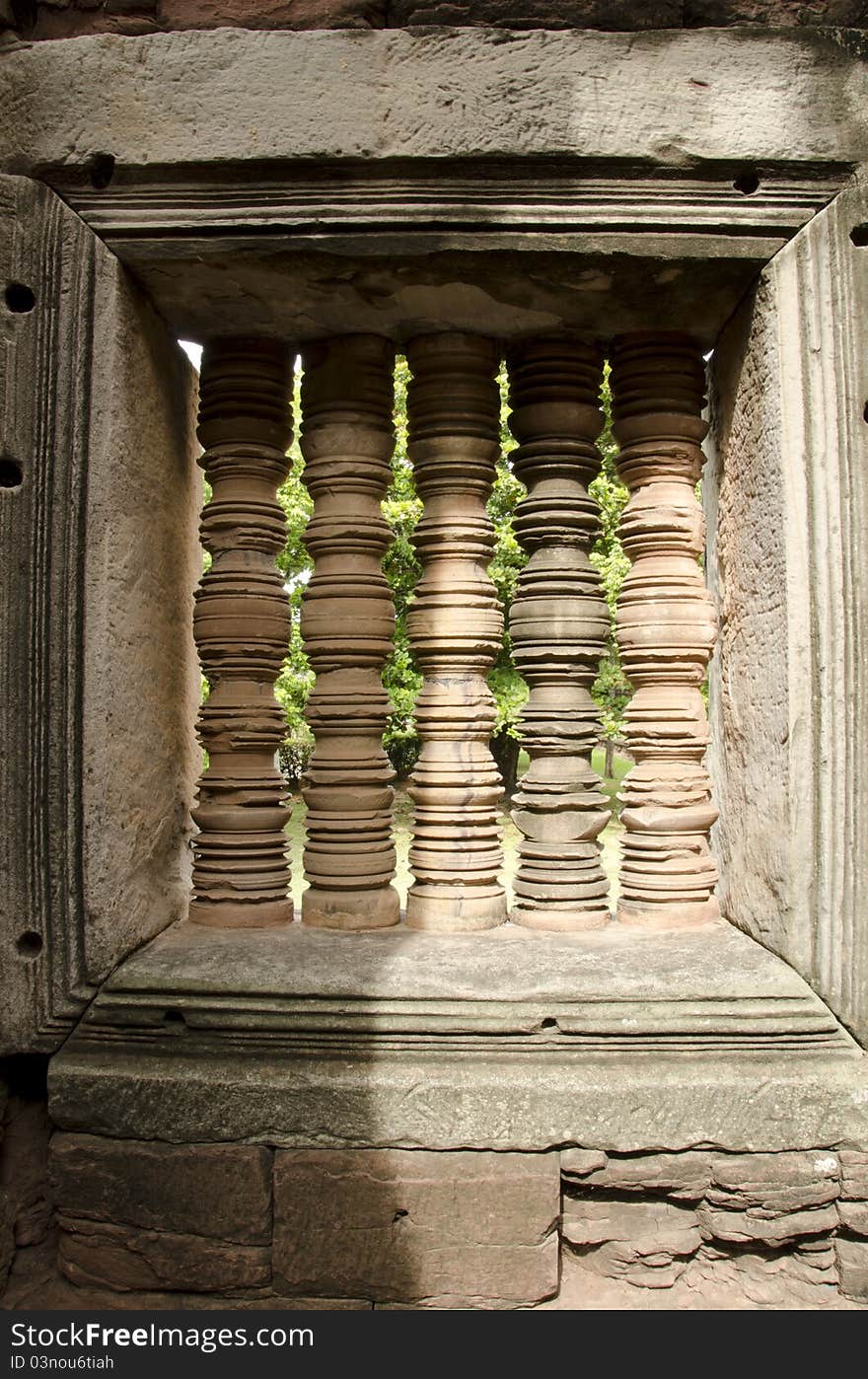 Antique pillar at a window from Pimai stone castle in Thailand