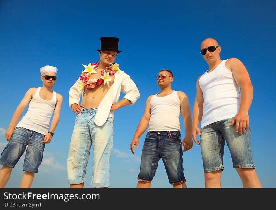 Group of friends against blue sky. Group of friends against blue sky