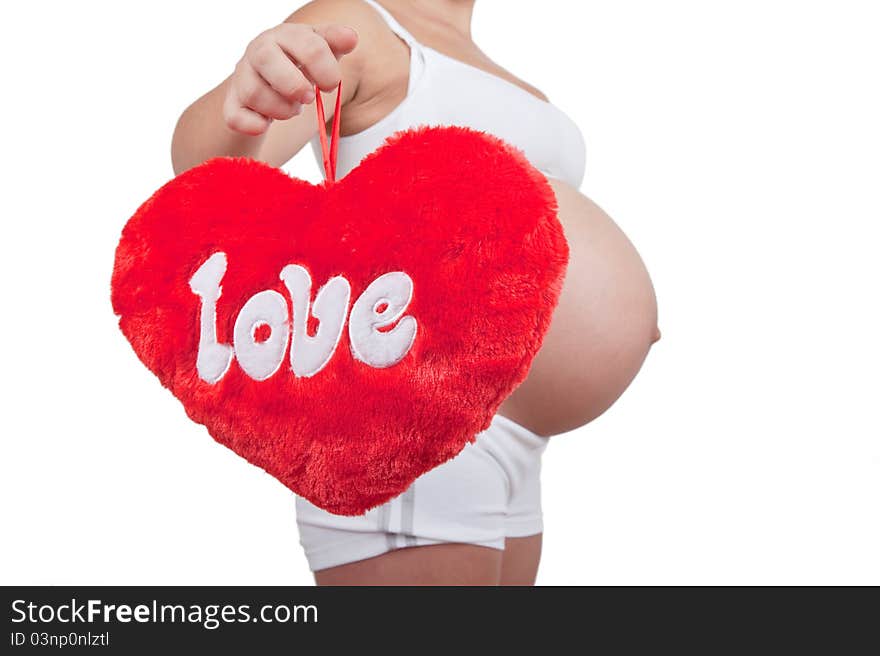 Pregnant woman hold red hart with love in hands on white background