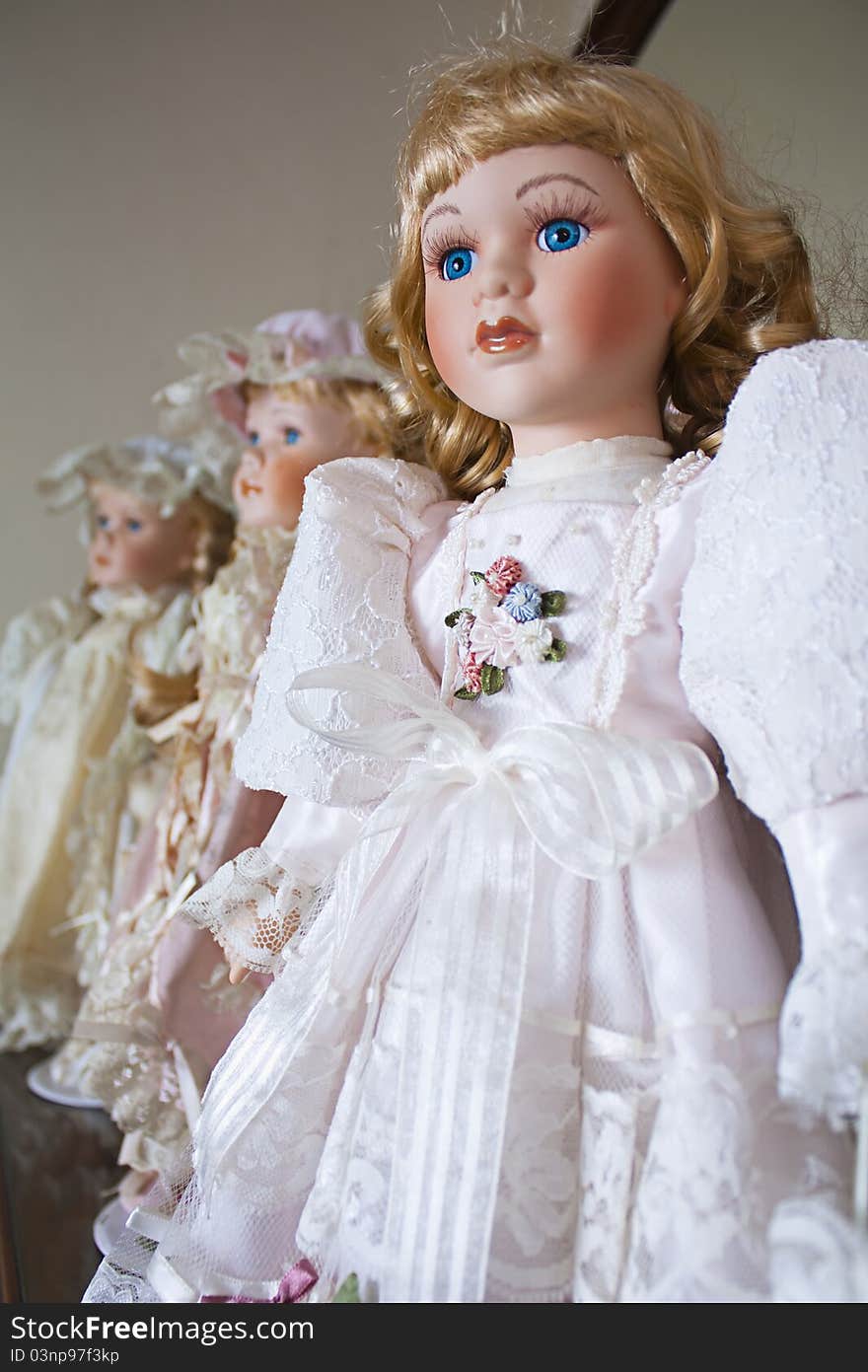 Collection of vintage porcelain dolls in Victorian and Edwardian dress