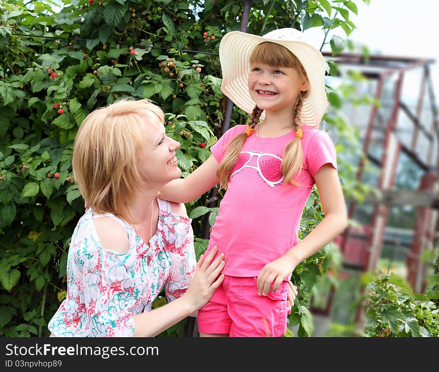 Mother and daughter gardening together